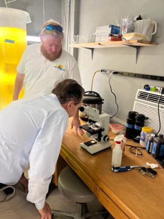 image of Buchanan looking through microscope